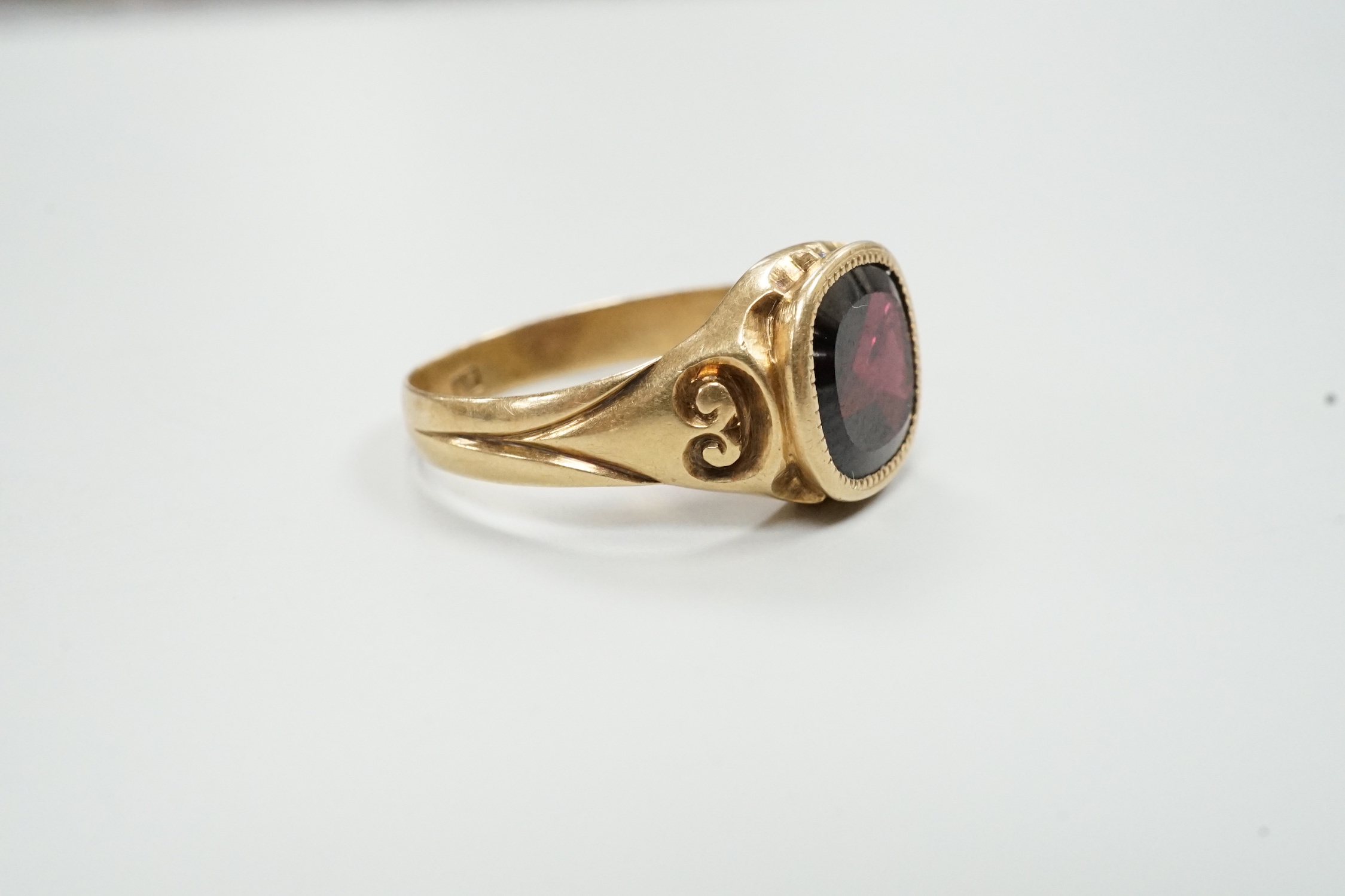 An early 20th century Austro-Hungarian? yellow metal and garnet set ring, size P/Q, gross weight 3.9 grams.